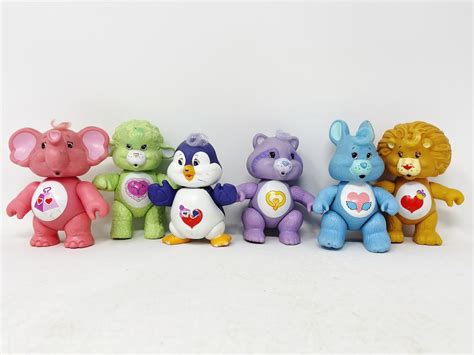 care bear lamb|care bears collection on shelves.